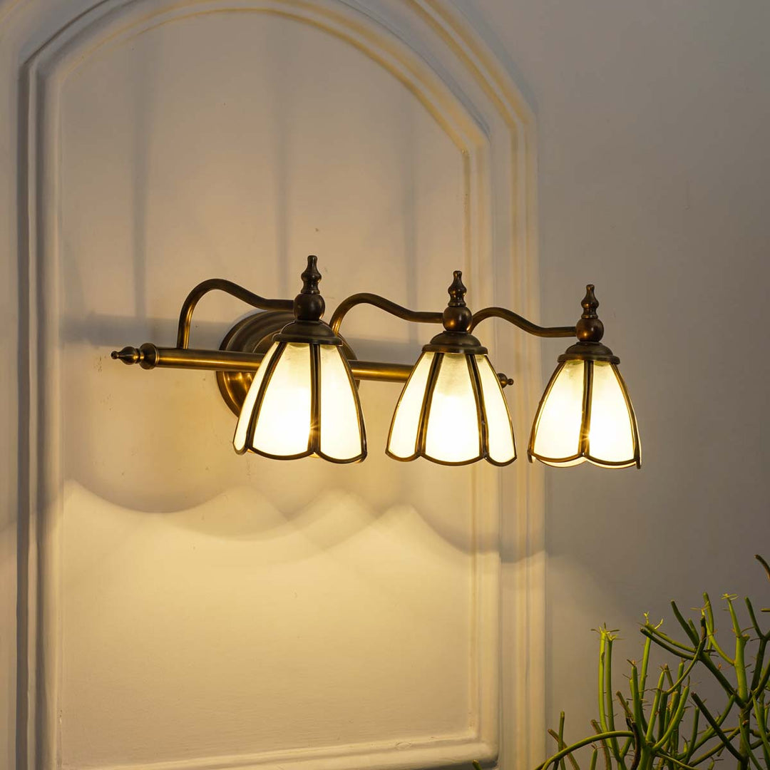 ORB lights mirror light in brass ant finish with frosted glass